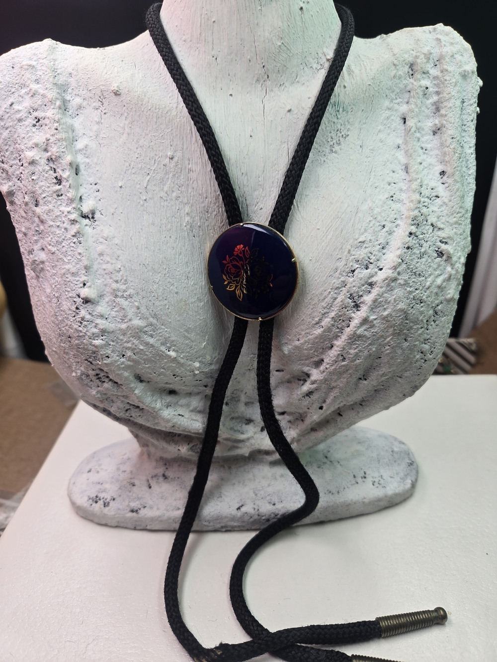 vintage 1970s Limoges style cobalt blue porcelain bolo tie featuring a gold flow